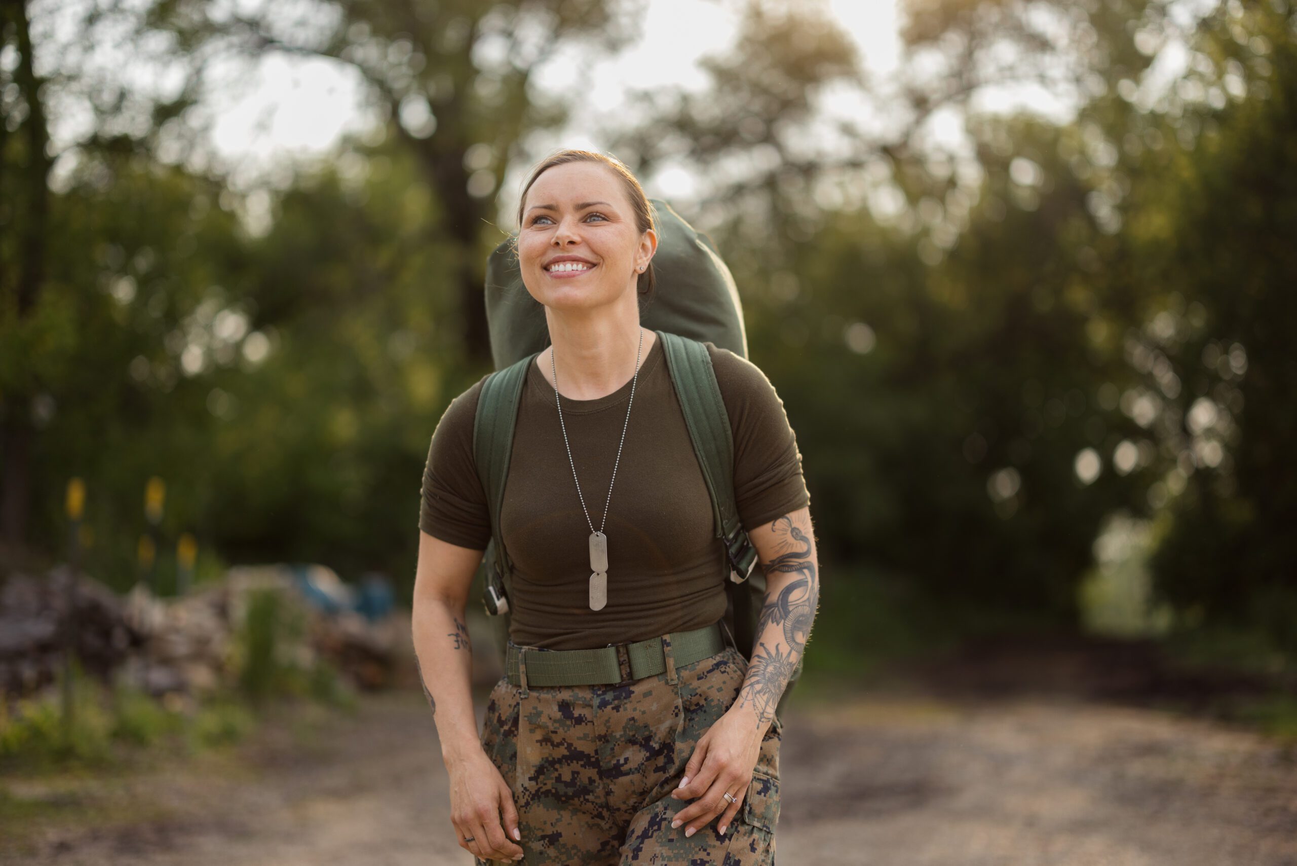 Woman hiking in military attire outdoors