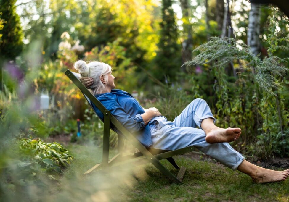 Elderly woman enjoying nature outdoors
